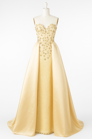 Yellow strapless gown with beaded bodice and long skirt.