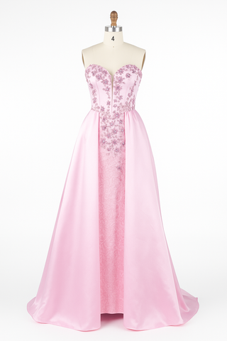 Pink strapless evening gown on a mannequin.