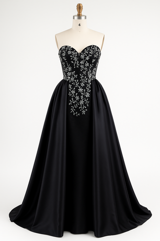 Black strapless formal gown with silver beading.