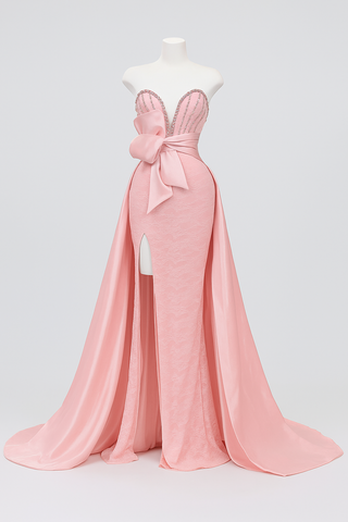 Pink strapless evening gown with bow and train.