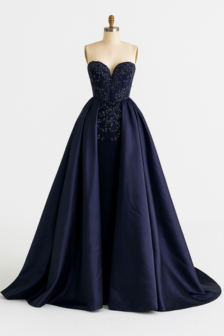 Navy blue strapless formal gown on a mannequin.