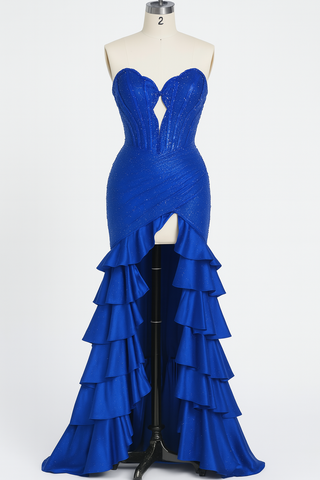 Blue formal gown on a mannequin with layered ruffles.