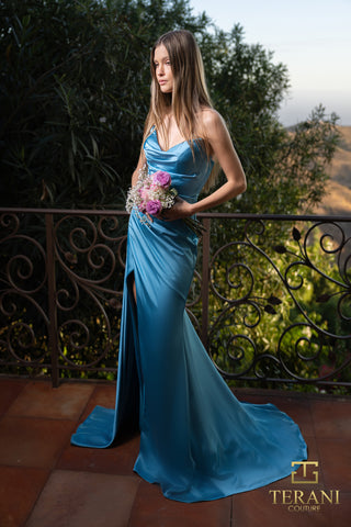 Woman in blue satin gown with flowers