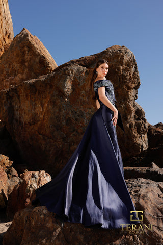Navy evening gown on woman near rocks