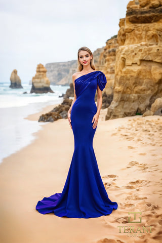 Royal blue one-shoulder gown on beach