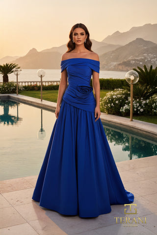 Blue off-shoulder gown 261M6419A overlooking ocean.