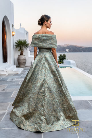 Seafoam green off-shoulder gown overlooking the sea.