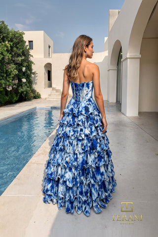 Blue ruffled gown in front of pool