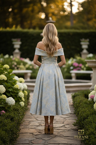 Woman in dress walking in garden.