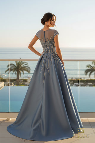 Slate blue evening gown by the sea