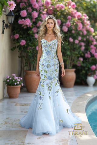 Blue beaded mermaid gown, floral background