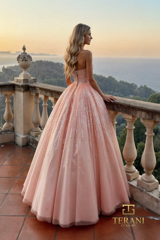 Blush pink gown on balcony overlooking the sea