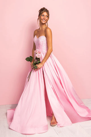 Woman in pink formal dress with roses