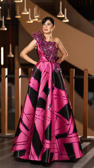 Woman in a pink and black gown.
