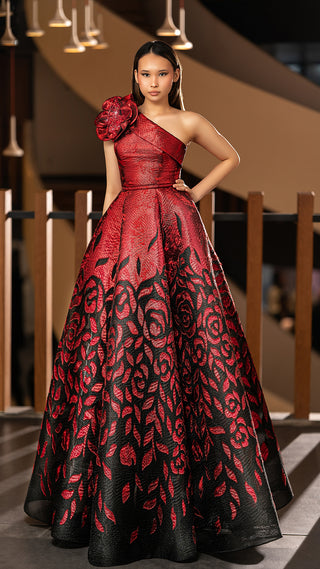 Woman in red and black floral gown.
