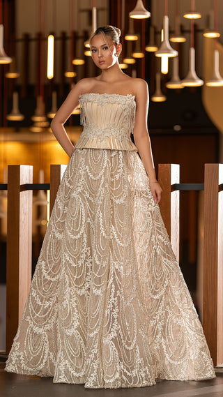 Woman in formal, strapless gown.