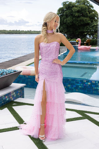 Woman in pink formal dress by pool