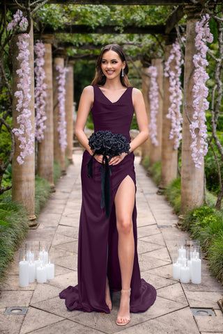 Amelia in aubergine gown with black bouquet.