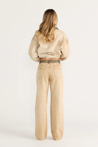 Woman in beige denim pant and jacket