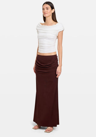 Woman in coffee-colored draped cowl skirt by Tuchuzy