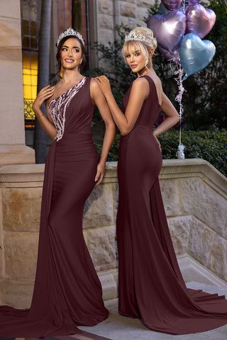 Diana in burgundy gowns with tiaras