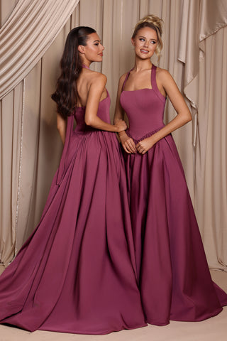 Two women in dusty plum formal gowns