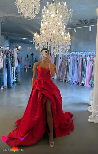 Woman in red gown, FullSizeRender, looking in mirror.