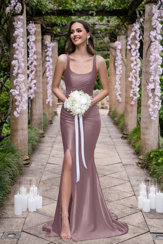 Isadora Dark Mauve gown with thigh slit, holding bouquet