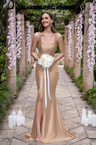 Isadora in gold gown holding bouquet