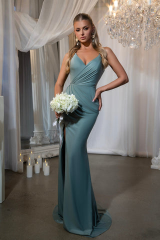 Lauren Fern in teal gown holding bouquet
