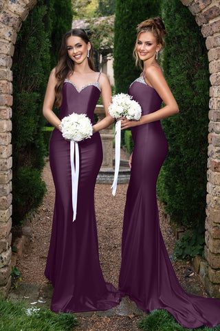 Louise in aubergine bridesmaid dresses with bouquets