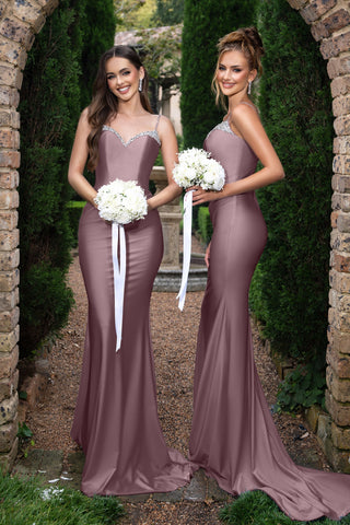 Louise in dark mauve bridesmaid dresses with bouquets