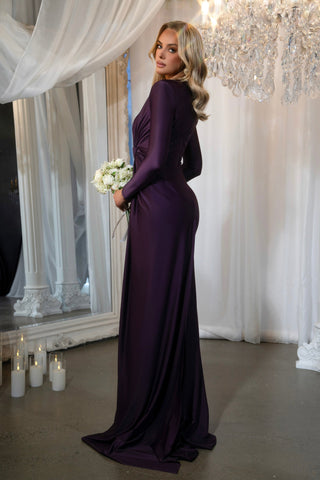 Woman in aubergine dress with flowers