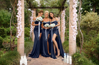 Orla Navy bridesmaids in dresses with bouquets