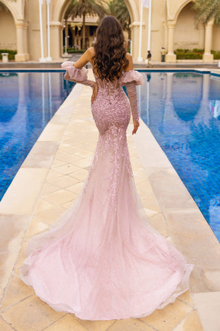 Woman in pink formal gown by pool