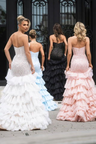 Ivory, nude, blue, black, & pink ruffled gowns.