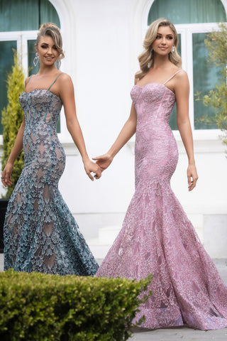 Two women in teal and pink lace formal gowns.