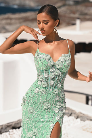 Mint floral embellished gown on a woman