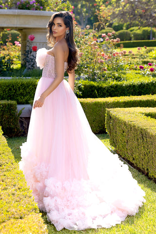 Pink strapless tulle gown in garden setting
