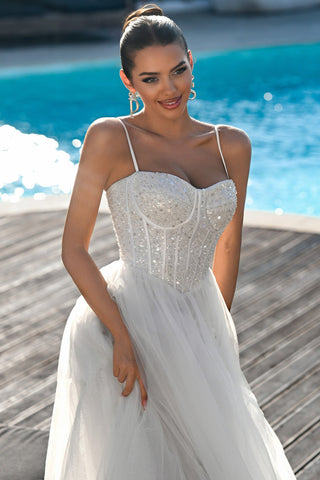 Ivory wedding dress PS25311, bride smiling by pool
