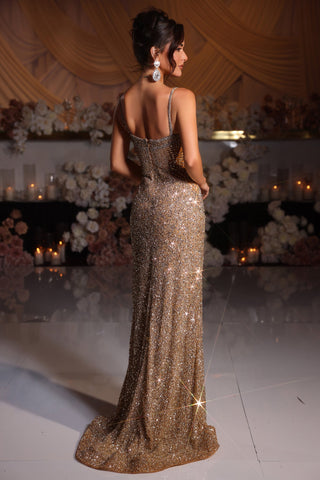 Woman in gold sequin gown