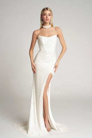 White beaded evening gown with high slit