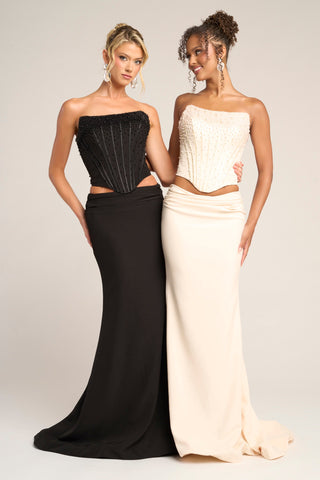 Two women in black and cream PS26007 formal gowns