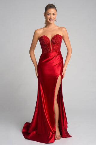 Red strapless formal gown with beaded bodice and slit