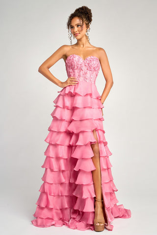 Pink strapless ruffled formal gown with high slit.