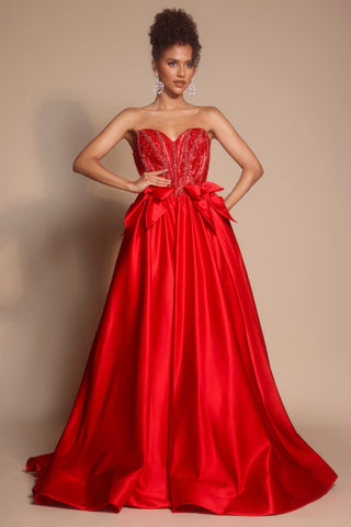 Red strapless formal gown with bow detail