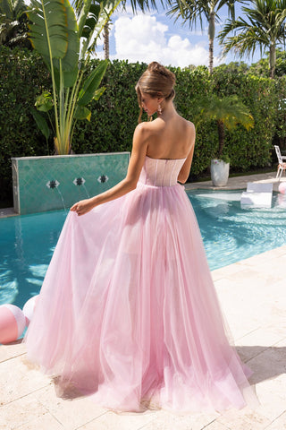 Pink strapless formal dress by pool
