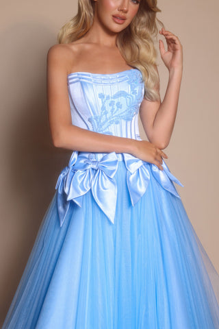 Light blue strapless formal dress with bow accents