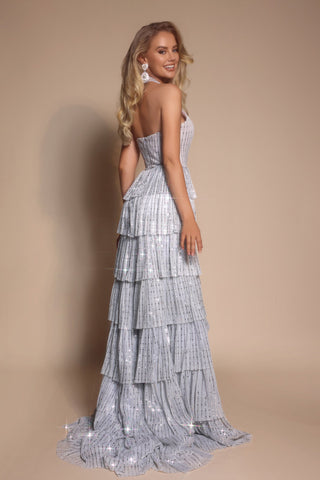 Woman in silver tiered gown