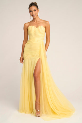 Yellow strapless gown PS26307E with high slit.